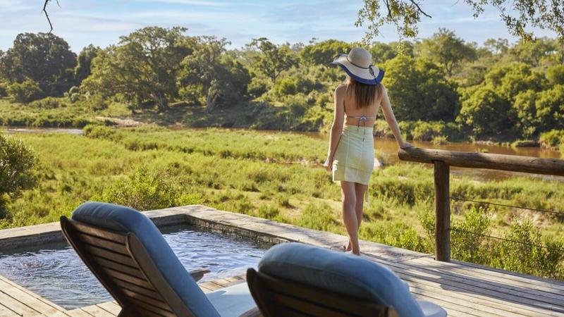 Luxury safari travel with a high-class travel companion in an exclusive lodge setting